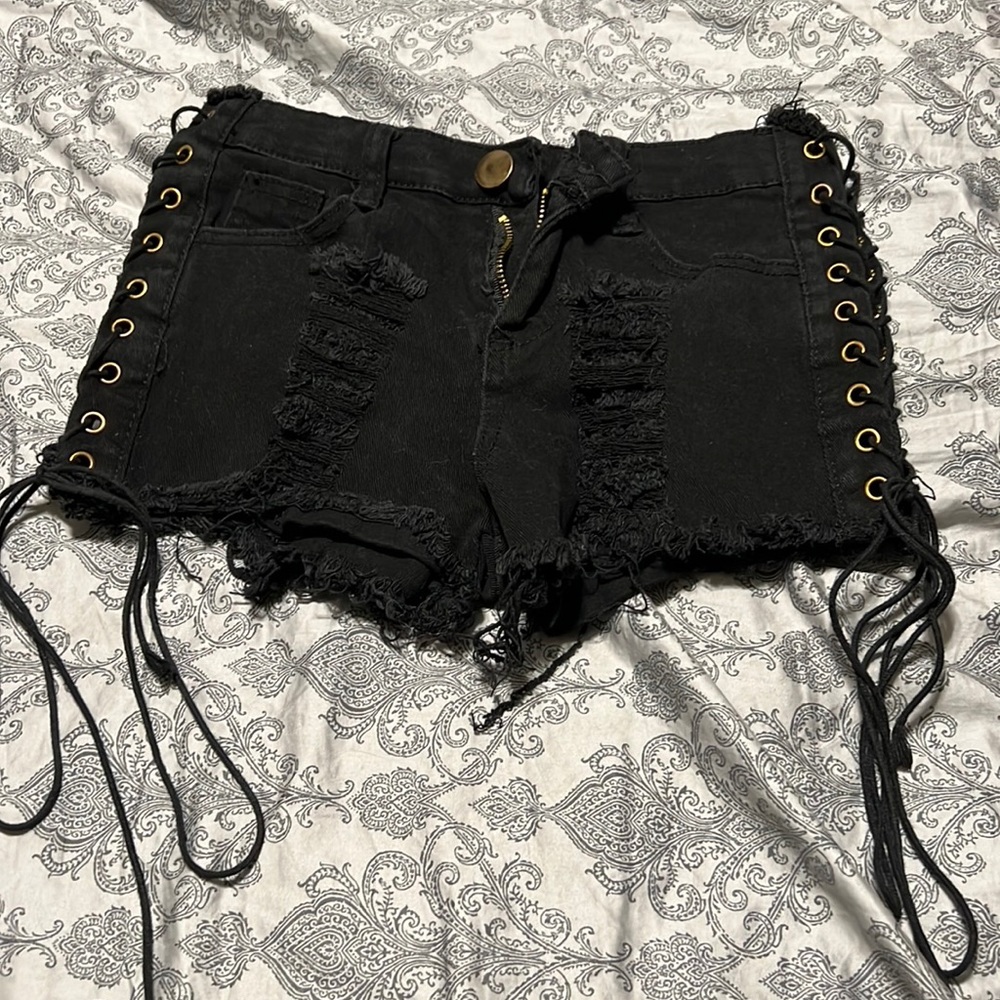 Black denim shorts lace up the sides, I got em off of Amazon